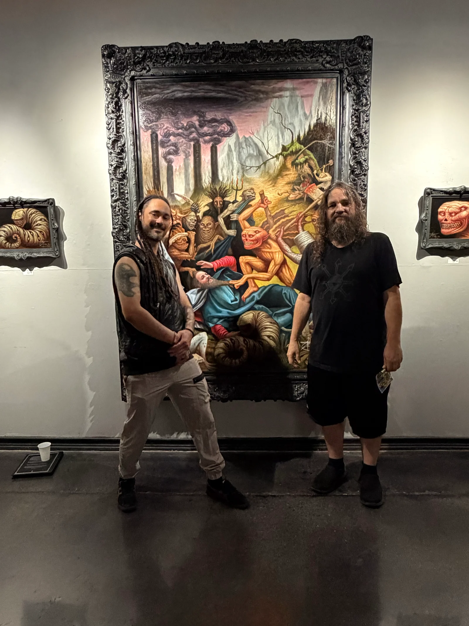 Cameron Cloud and Chet Zar at Copro Gallery, in front of The Temptation of Saint Anthony.
